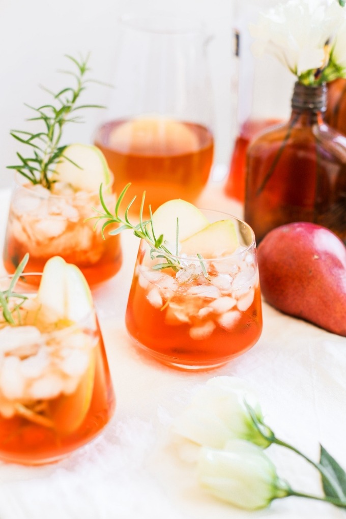 15 fall cocktails - aperol spritz in wine glasses on white board