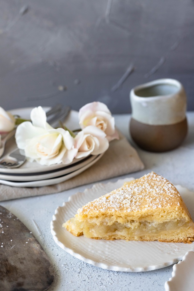 apple shortcake on white plate with roses 