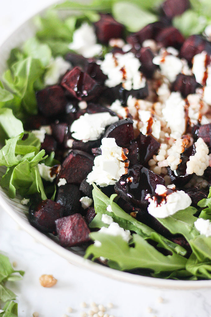 close up beetroot goat cheese salad in white bowl