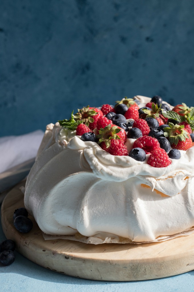 pavlova on an antique wooden board