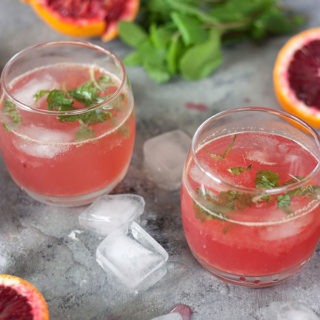 This blood orange ginger cocktail is perfect for the changing weather! A light, refreshing cocktail, brought to life with a beautiful ginger-mint simple syrup! #citrus #cocktails #vodka #bloodorangecocktail