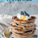 stack of blueberry kefir pancakes on white plate with blue banner and text for Pinterest