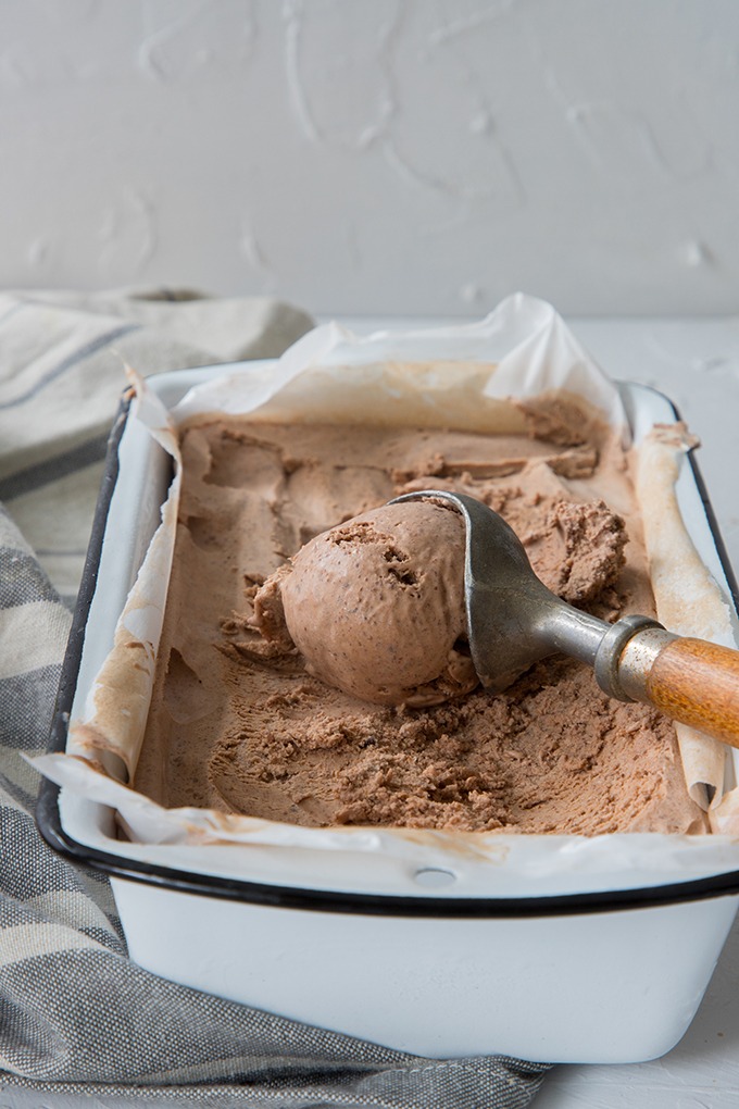 chili chocolate ice cream in enamel loaf pan with antique wooden ice cream scoop