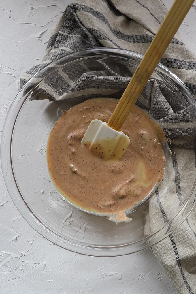 glass bowl of condensed milk, with a small amount of chocolate cream.