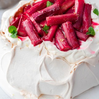 Christmas pavlova with rhubarb on marble board