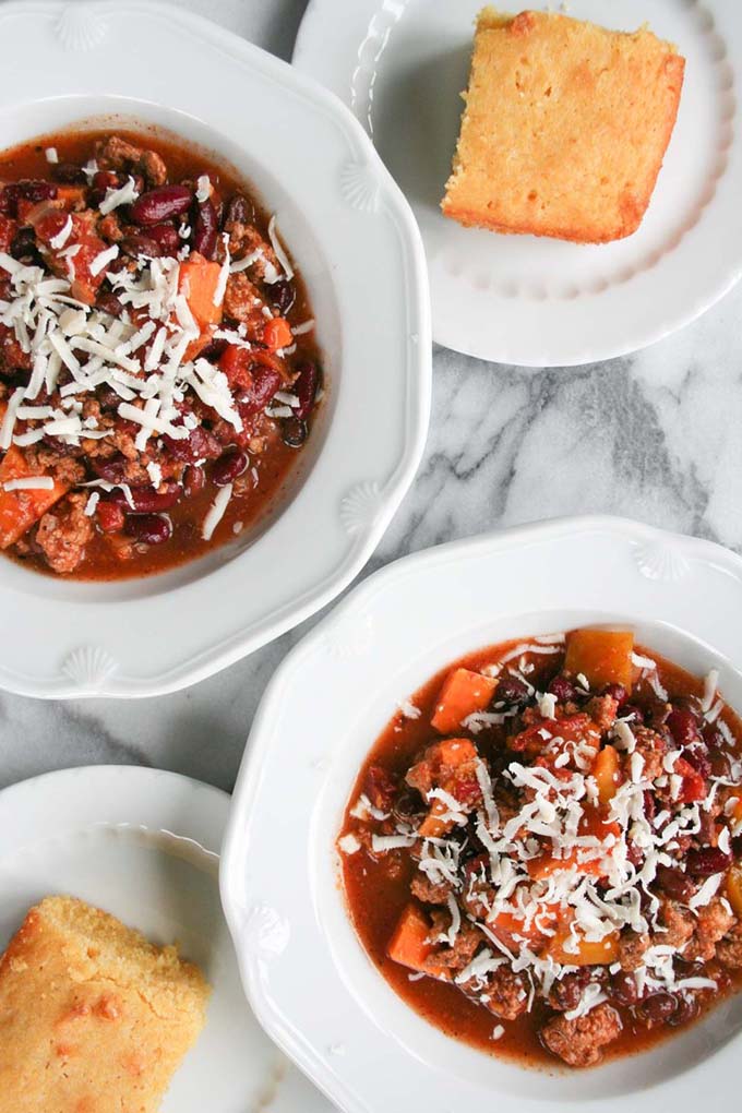 two turkey chili bowls on marble board