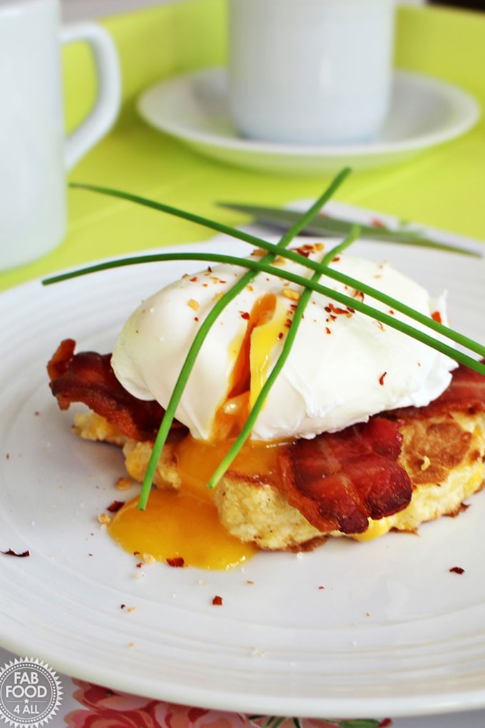 poached egg on a bacon hashbrown with chives