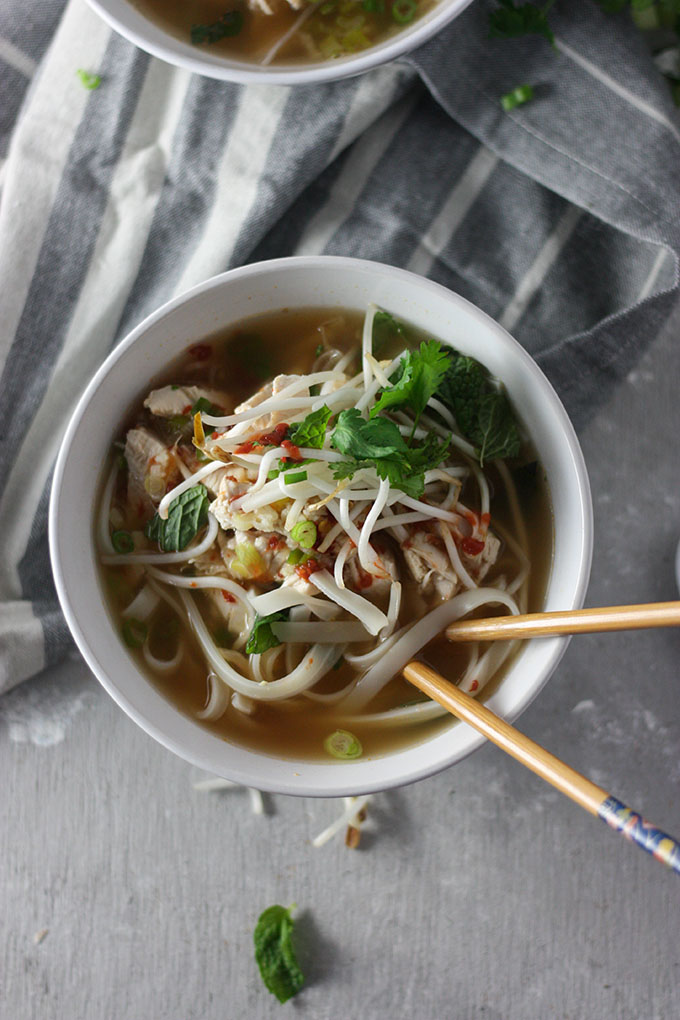 close up chicken pho on grey napkin