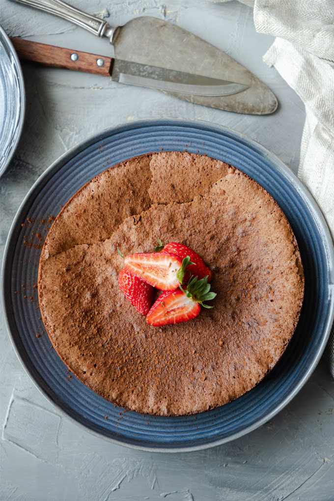 flourless chocolate torte on blue plate