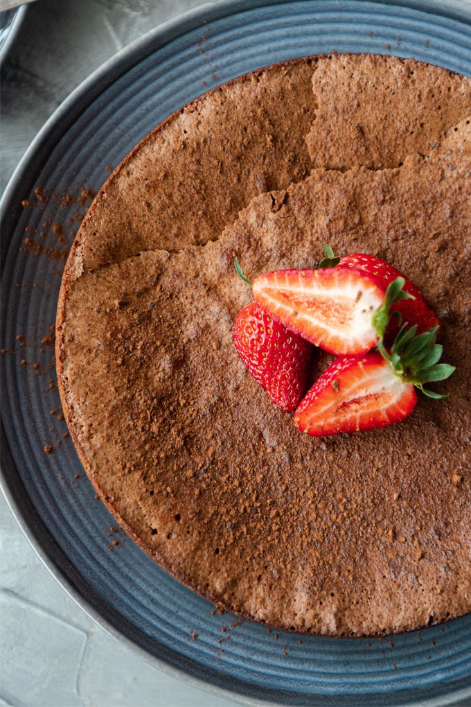 flourless chocolate torte on blue plate