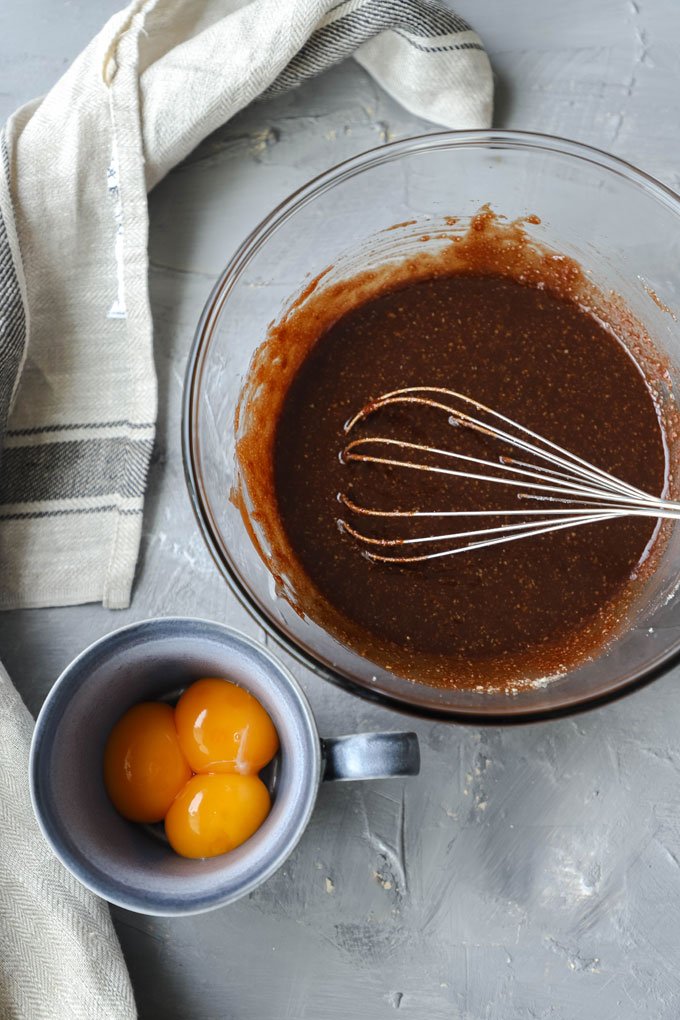 eggs next to chocolate batter for flourless chocolate torte