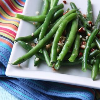 green beans with hazelnut garlic butter www.thehomecookskitchen.com perfect for a winter side dish, crunchy and oh so buttery.