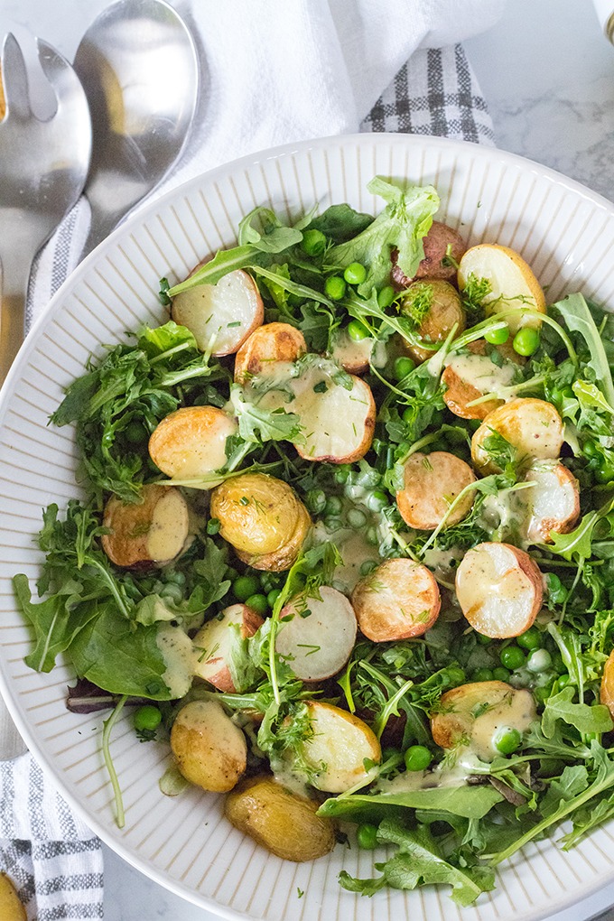 honey mustard potato salad in a large white salad bowl