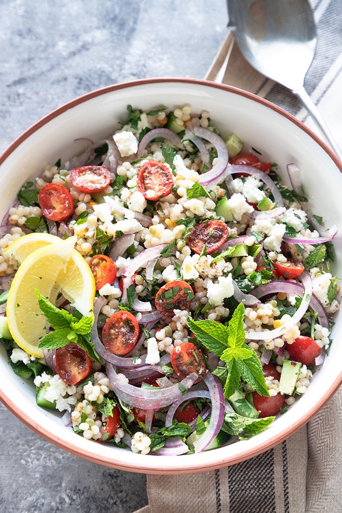 israeli couscous in a white terra-cotta bowl