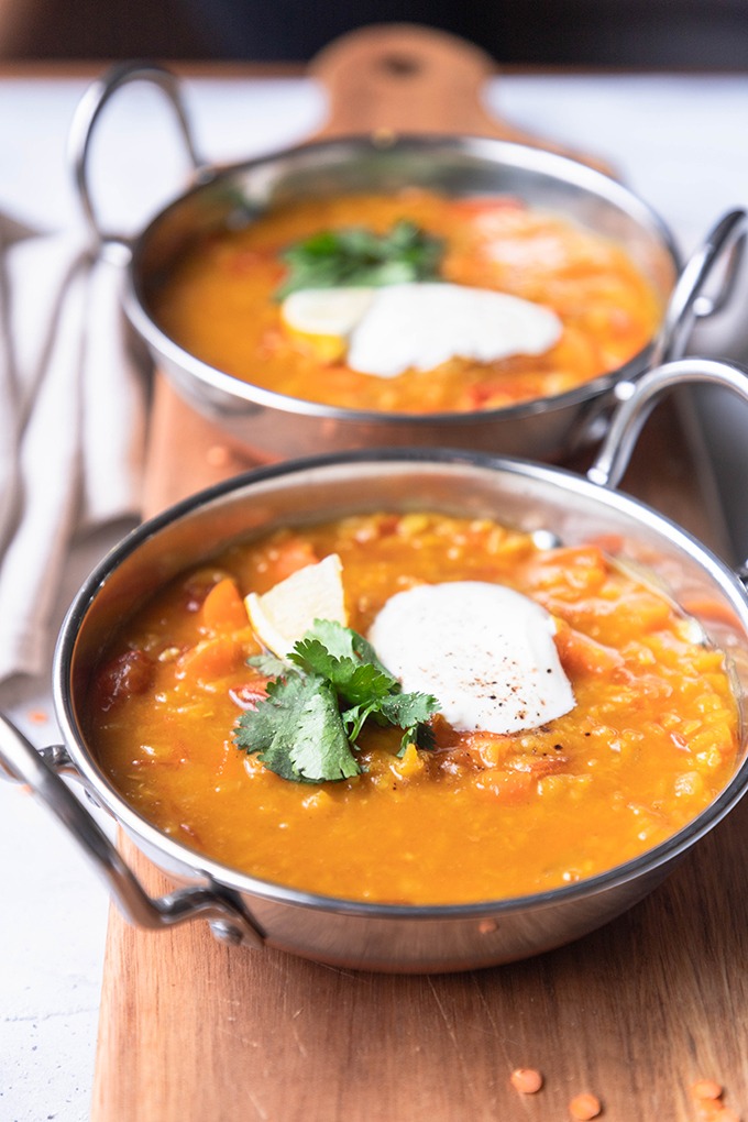 front of view of lentil dal in metal pots