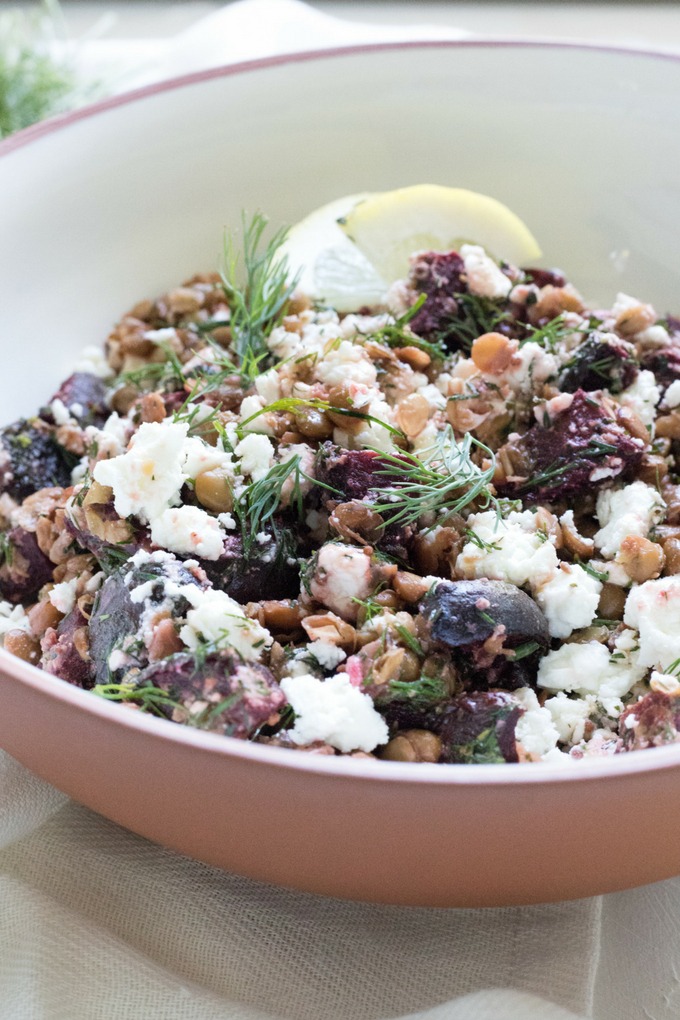 feta lentil salad in brown and white bowl