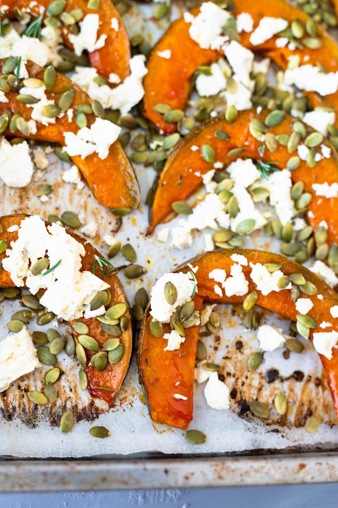 roast pumpkin on baking tray topped with feta and pepitas