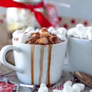 hot chocolate overflowing in white mug