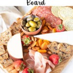 Pinterest graphic - meat and cheese board with text on white banner at top of image