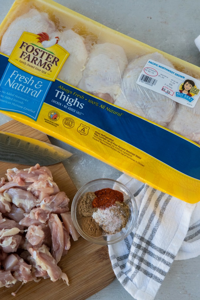 chicken on board with spice mix and packet of foster farms chicken thighs