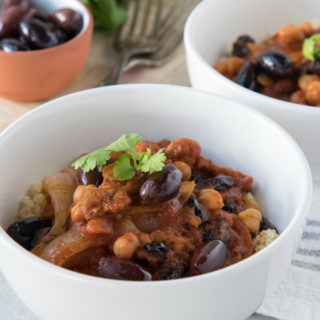 moroccan chicken stew in a white bowl