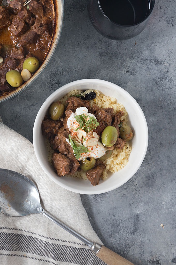 white bowl of moroccan lamb tagine on grey board