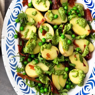 pesto potato salad on blue enamel plate