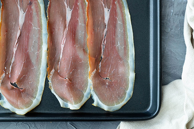 prosciutto on baking tray for pesto potato salad