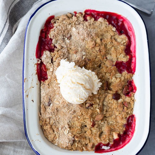 rhubarb crumble in enamel dish with ice cream