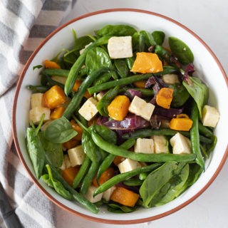 roast pumpkin salad in salad bowl with napkin