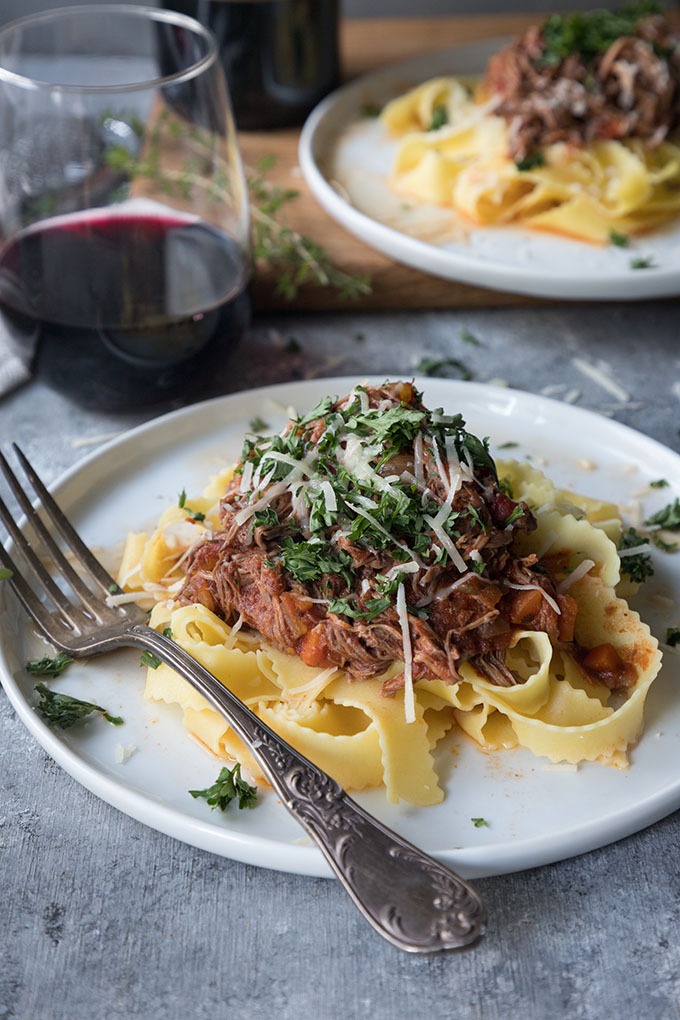 front view slow cooker beef ragu on white plate