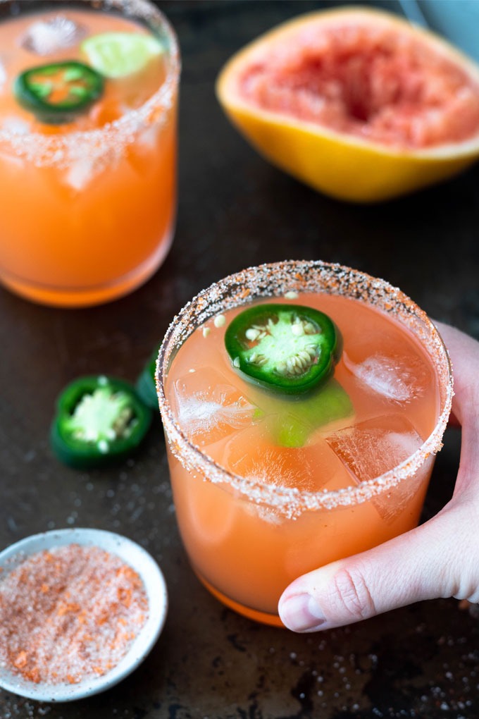 hand reaching out to grab spicy margarita