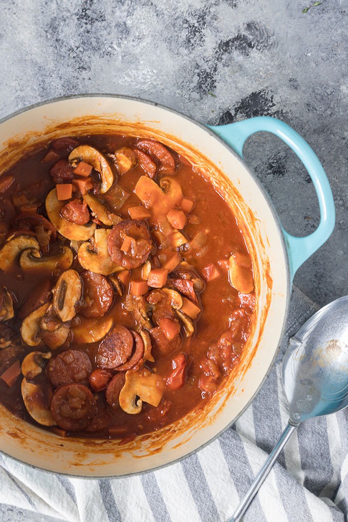 tomato chorizo pasta sauce in blue dutch oven