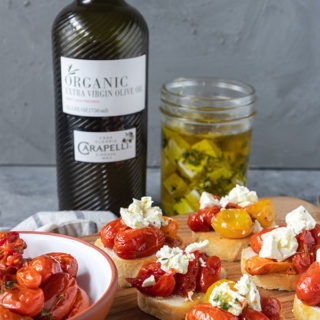 tomato crostini on wooden board