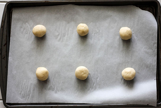 tray of cookie dough, 6 vanilla sandwich cookie dough rolled into small balls